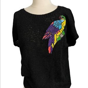 womens black sweater w/embellished bird detail. size large.